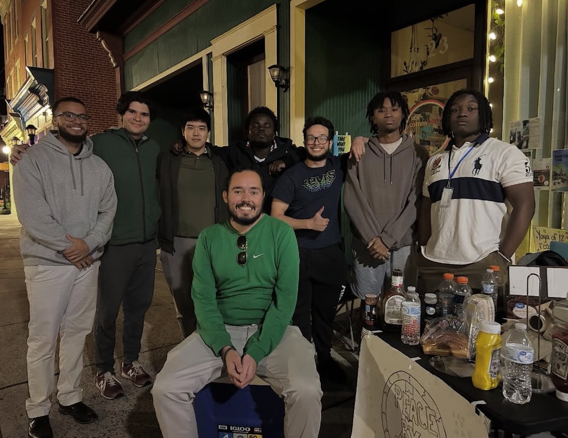 Cullen O'Donnell with Peace by Piece participants in the community
