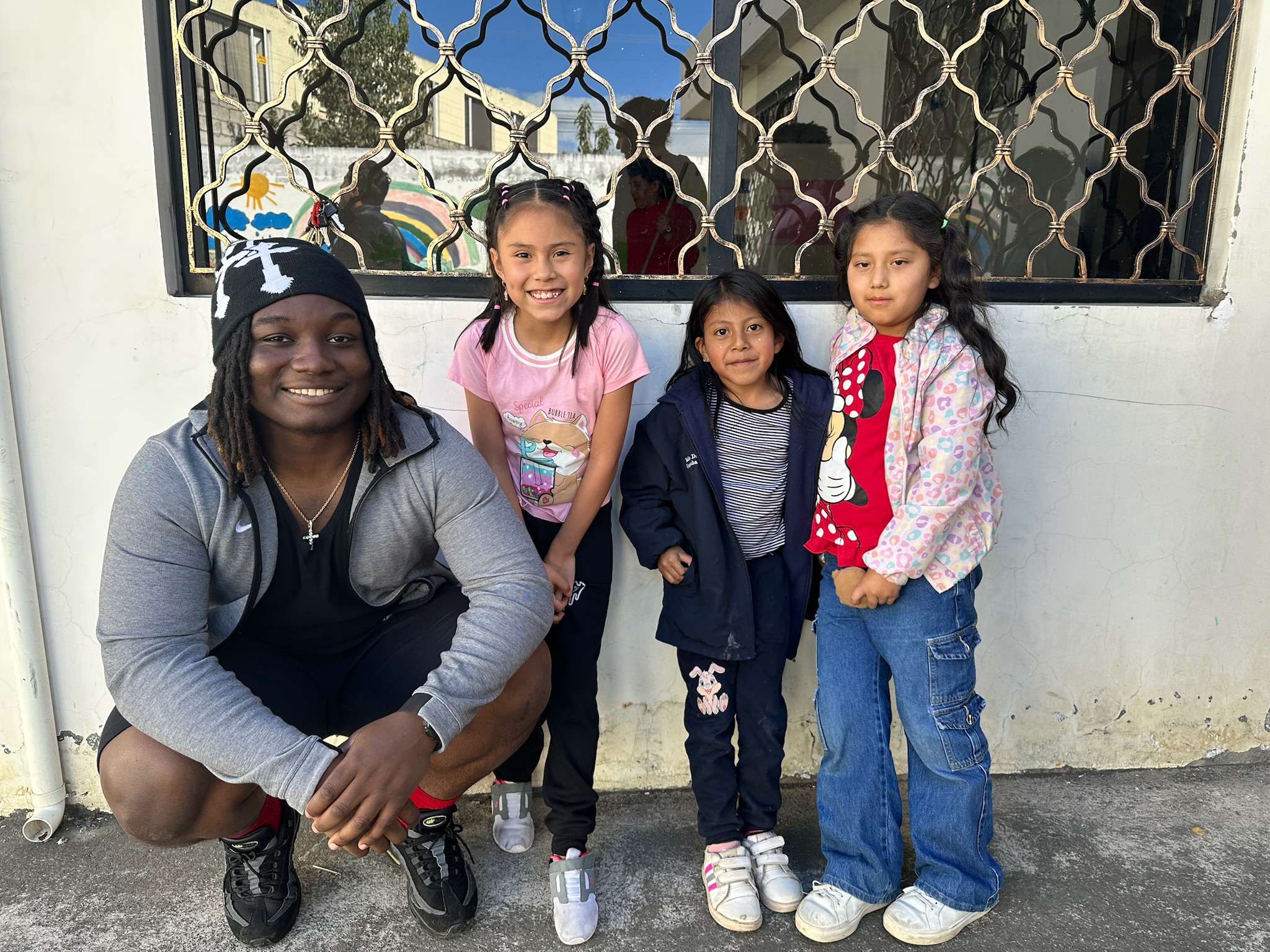 Peace by Piece participant with children in Ecuador